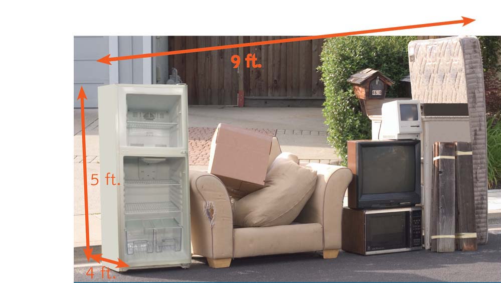 Bulky items like a couch, refrigerator, and mattress on curb measuring no more than 7 cubic yards